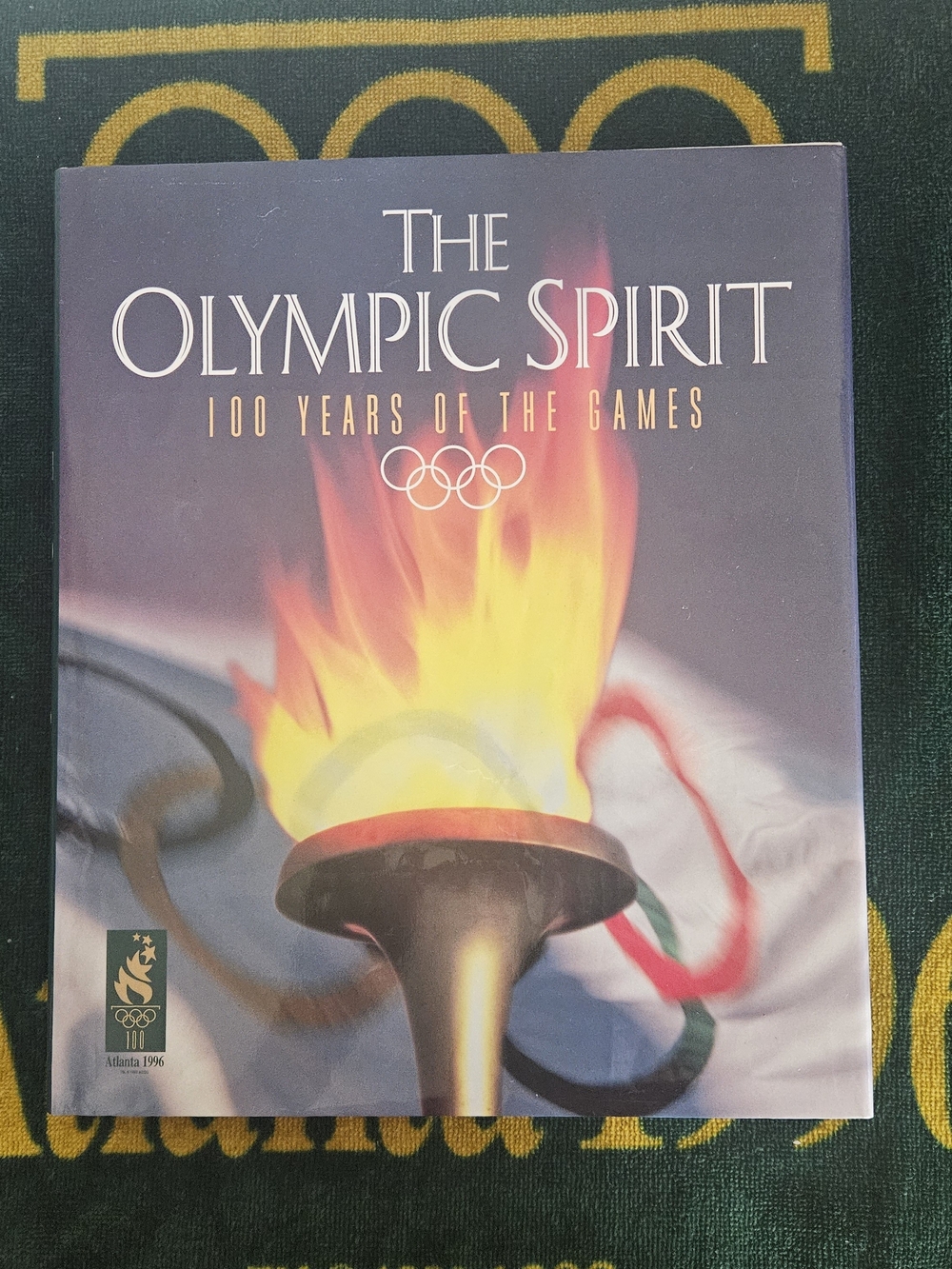 The Olympic Spirit: 100 Years of the Games – Hardcover Book (Black/Yellow/Red)